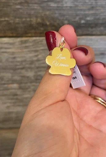 Gold paw-shaped pet tag